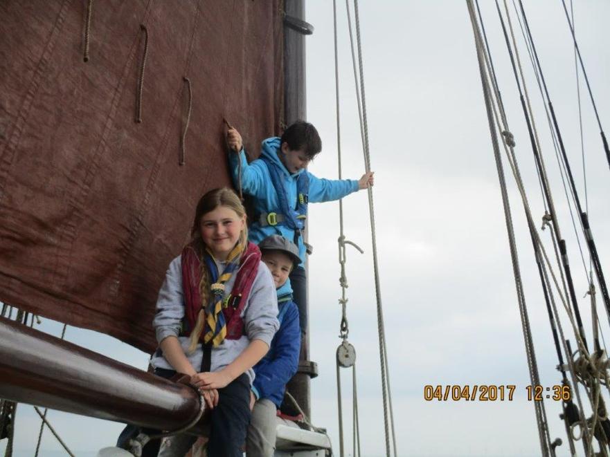 Popular spot for posing: Sea Scouts on the boom of smack Sallie ©Richard Tichener 